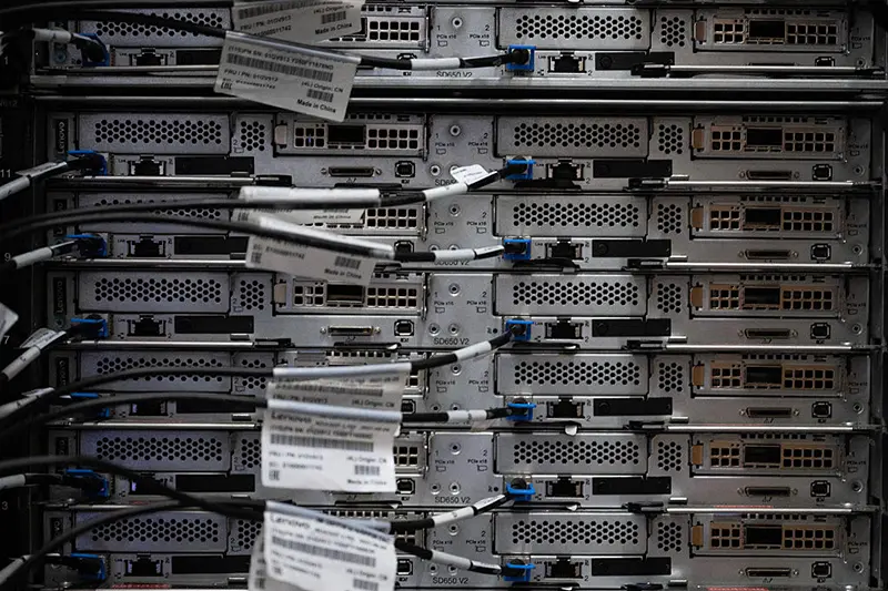 A cabinet holding racks and active servers. (Photo by ANDREW CABALLERO-REYNOLDS / AFP via Getty Images)
