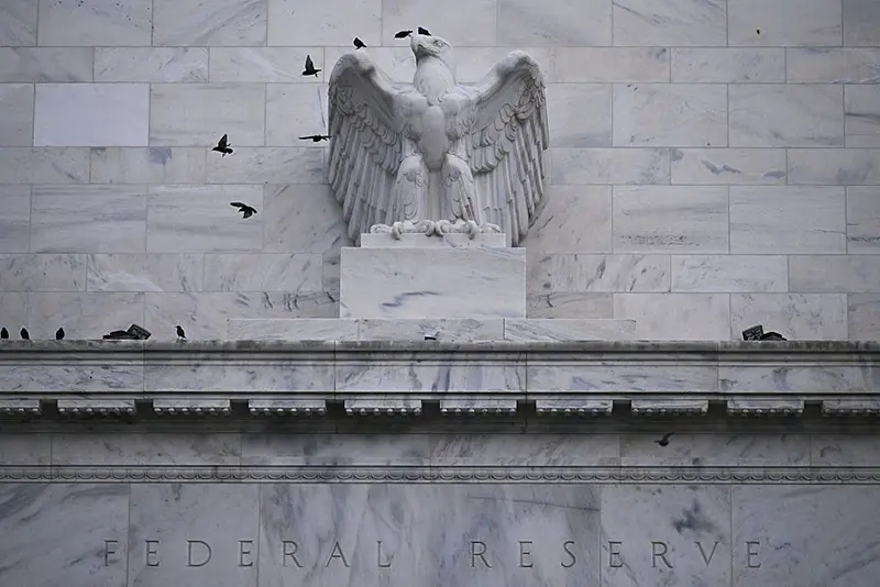 Birds are seen on the outside of the Marriner S. Eccles Federal Reserve building in Washington, DC, on December 30, 2025. (Photo by Brendan SMIALOWSKI / AFP via Getty Images)