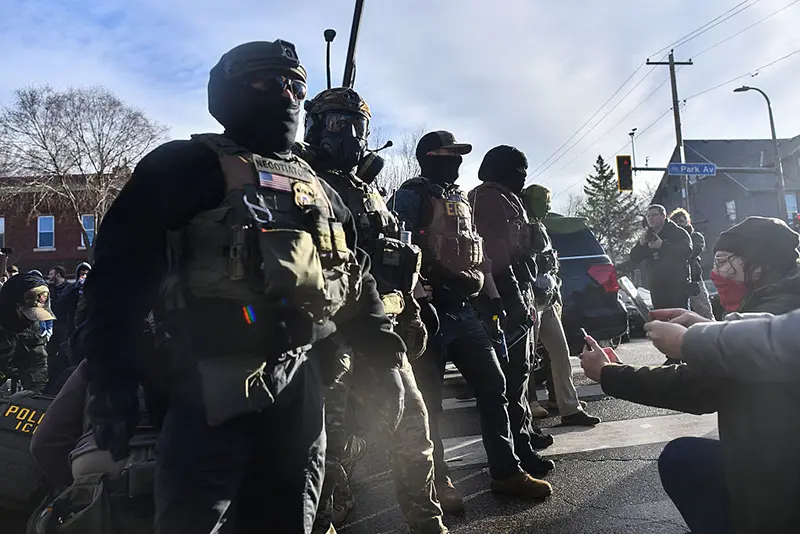 Protestors gather as ICE and other federal agents operate in Minneapolis, Minnesota, on January 13, 2026. (Photo by Octavio JONES / AFP via Getty Images)