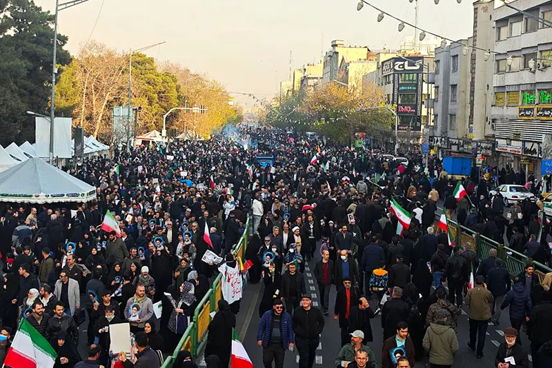 People join a pro-government rally on January 12, 2026 in Tehran, Iran. Tens of thousands of demonstrators gathered in Tehran's Enqelab Square. (Photo by Stringer/Getty Images)