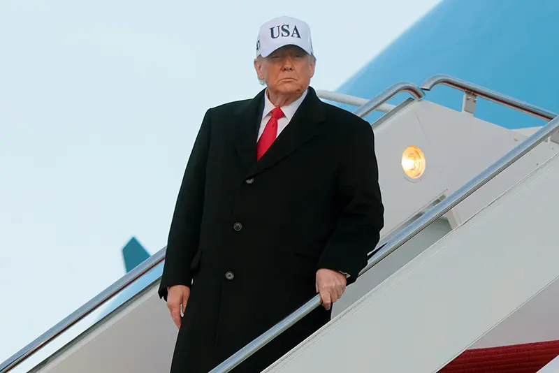 President Donald Trump walks down the air stairs after landing on Air Force One on January 13, 2026 at Joint Base Andrews, Maryland. (Photo by Anna Moneymaker/Getty Images)