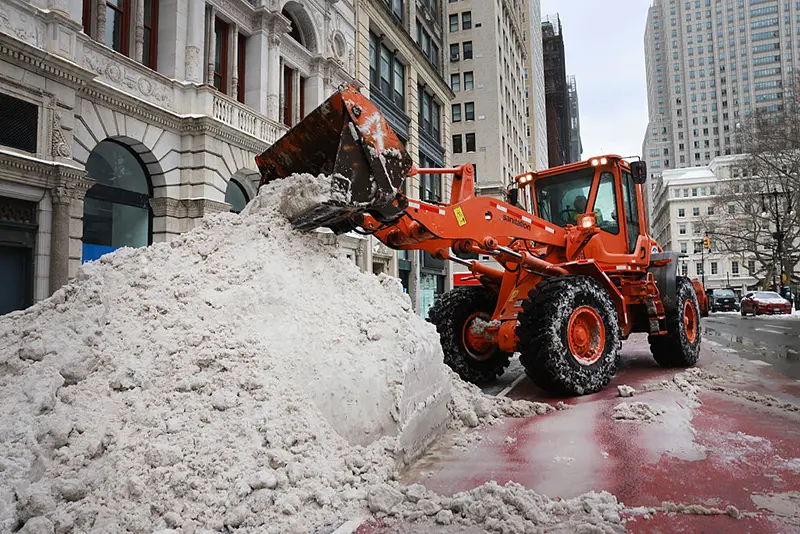 A plow moves snow outside of City Hall in Manhattan after a storm left nearly one foot of snow on January 26, 2026 in New York City. (Photo by Spencer Platt/Getty Images)